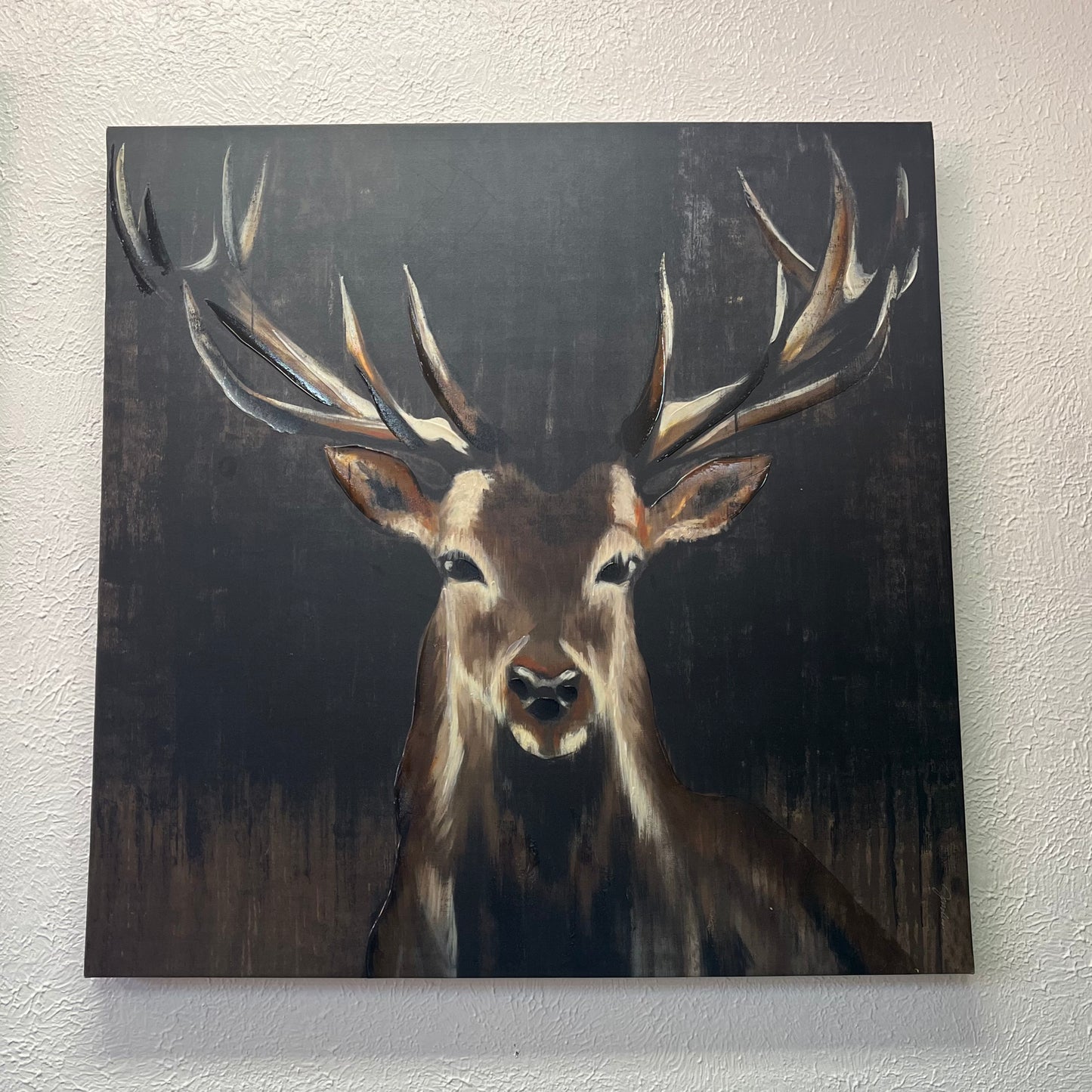Painting of a deer with large antlers on a dark background