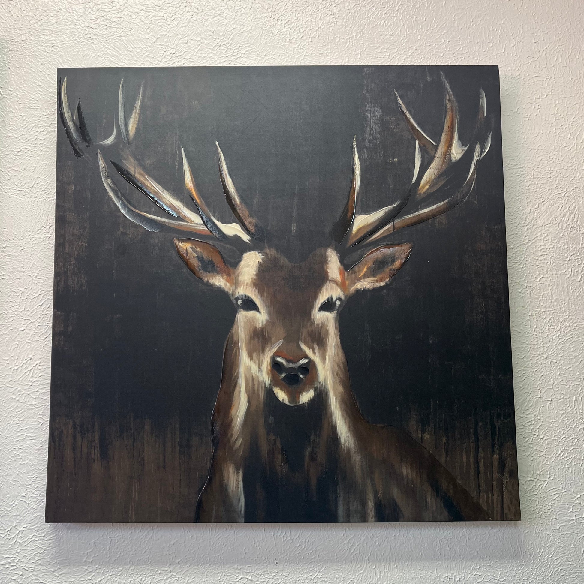Painting of a deer with large antlers on a dark background